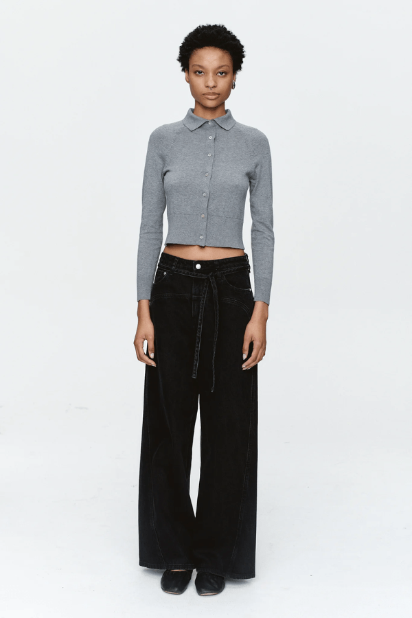 Tie Curve Seam Jean Black by Marle, trendy mid-rise jeans with unique curved seam detailing and a relaxed, wide-leg fit. Perfect for a versatile, structured look with a detachable tie belt.
