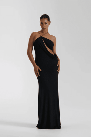 Elissa Dress Black by Natalie Rolt – A glamorous stretch-knit maxi with metallic threads, asymmetrical cutaway, and adjustable fit, perfect for elegant evenings and special occasions.