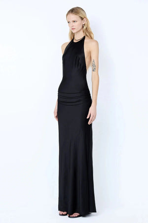 Quentin Racer Maxi Dress by Bec + Bridge, a sleek backless halter with rouleau trim and bias-cut skirt. Perfect for elegant evenings.