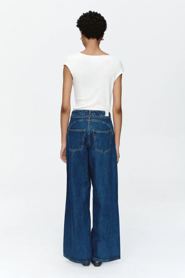 Tie Curve Seam Jean Heritage Blue by Marle, trendy mid-rise jeans with unique curved seam detailing and a relaxed, wide-leg fit. Perfect for a versatile, polished look with a detachable tie belt.