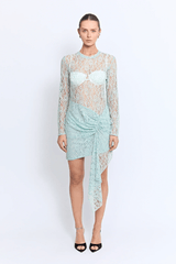 Vero Lace Dress Mint by Pfeiffer – A sheer lace mini with full sleeves and a decorative tail, perfect as a beach cover-up, vacation statement, or summer night-out essential.