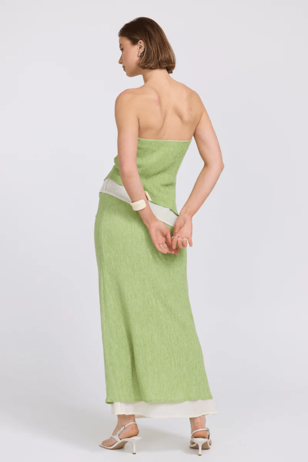 Aperitivo Top Pistachio/Cream by Sovere — strapless, longline, textured lyocell blend with concealed elastic and asymmetric hem. Reversible design. Model: 178cm, size 8.