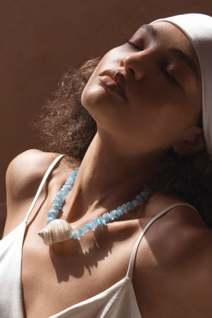 Cassis Necklace by Amber Sceats, handcrafted in Italy with aquamarine stones and seashells plated in 24K gold for coastal luxury.