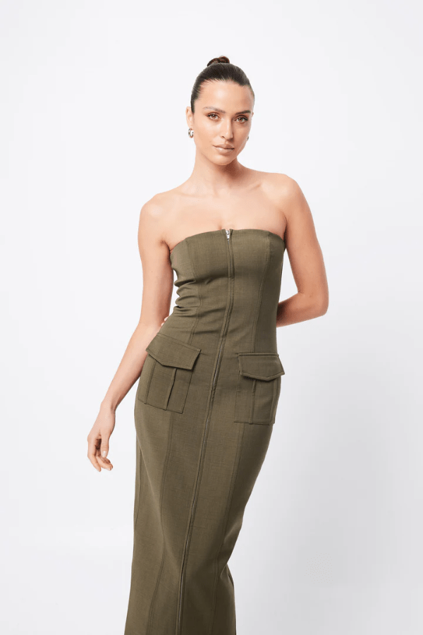 Low Profile Midi Dress Khaki by Mossman – A chic, strapless utility-inspired midi with exposed zip, front pockets, and back split, perfect for modern, versatile styling.