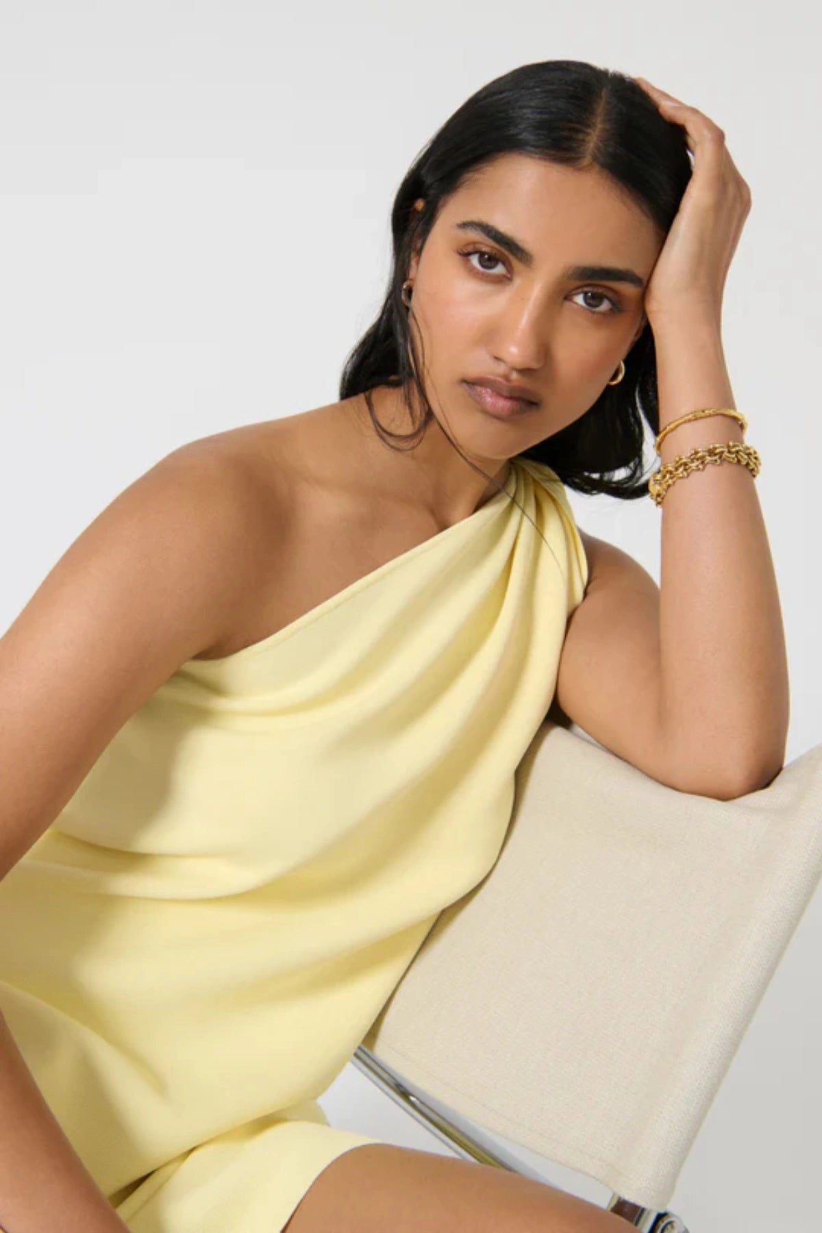 Loreta Twist Dress – Butter by Onte, a crepe knit mini with one-shoulder twist. Perfect for elevated summer dressing or nights out.