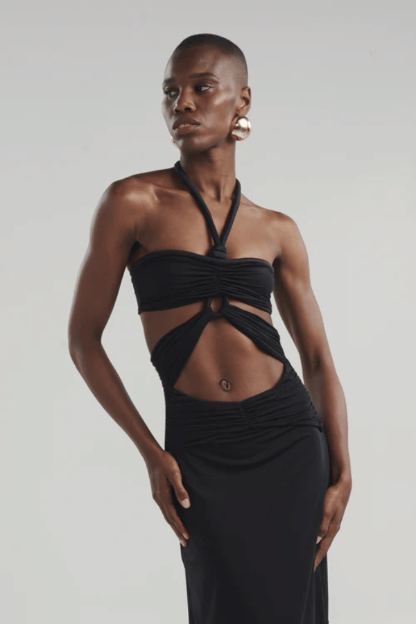 Migramah Black by Maygel Coronel – Draped dress with handmade knot, waist cutout, and shirred hips for flattering fit.