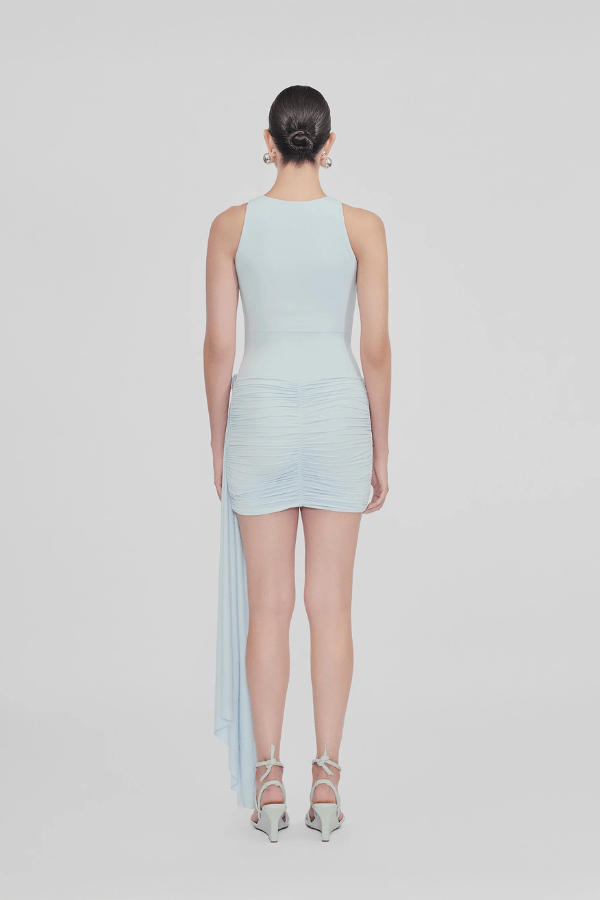 Azahar Arctic by Maygel Coronel – A trendy mini dress with memory-shape fit, draped skirt, side sash, and 3D flowers, perfect for chic events and nights out.