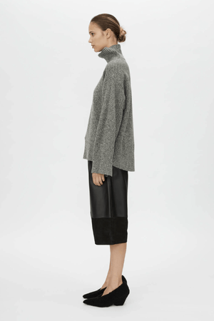 Breccia Knit Sweater Khaki by Camilla and Marc – Trendy oversized merino wool sweater with ribbed details and a modern split back, perfect for casual layering.