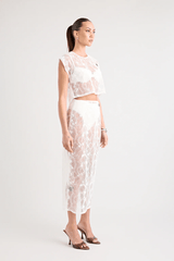 Astrid Lace Top White by Pfeiffer, dreamy lace with keyhole back and relaxed fit, perfect for trendy viral layering over bras or bikinis and chic day-to-night styles.