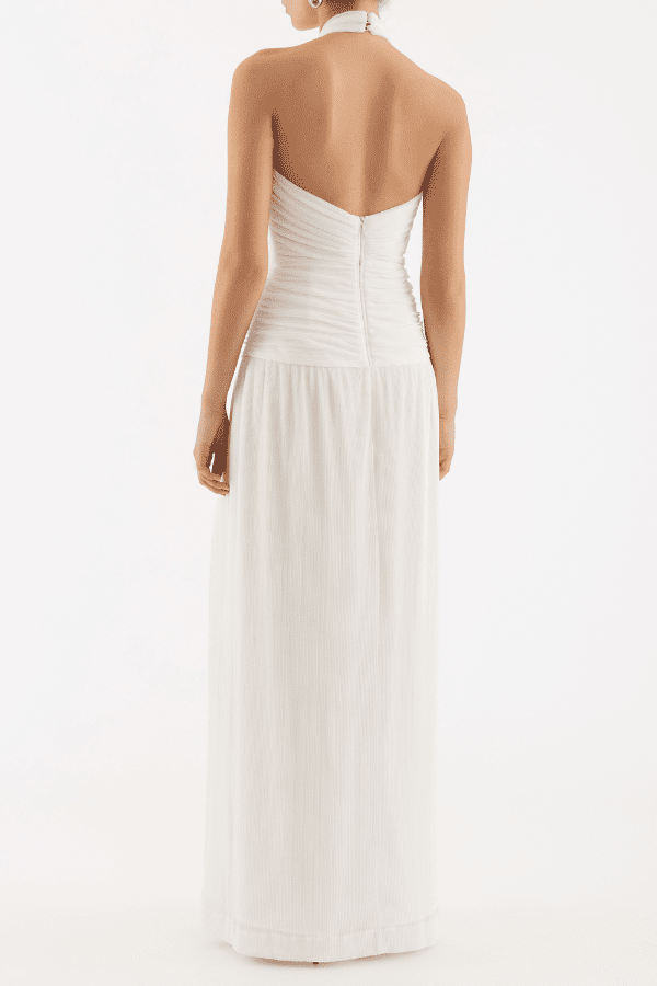 Guinevere Halter Gown Ivory by Rebecca Vallance – Halter gown with ruched waist, floral applique, open back, and front split.