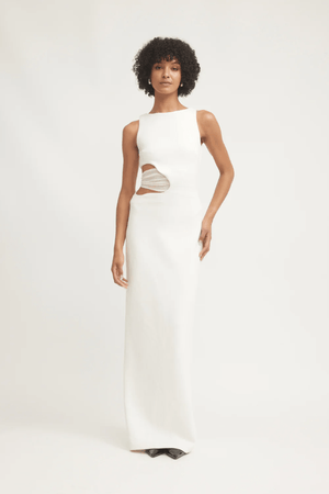 Valentina Dress Ivory by Tojhà – A sophisticated maxi in ultra-soft crepe with boat neckline, curved cut-out, and mesh detail, perfect for elegant evening occasions.