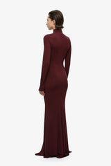 The Gathered Long Sleeve Maxi Dress by MISHA, ruched jersey maxi with mock neck and flared hem for sculpted evening styling.