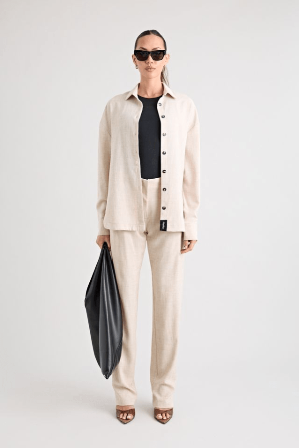 Pino Trouser natural by Pfeiffer, mid-rise tailored pants with front pleats and side pockets, perfect for day-to-night wear and office to evening events.