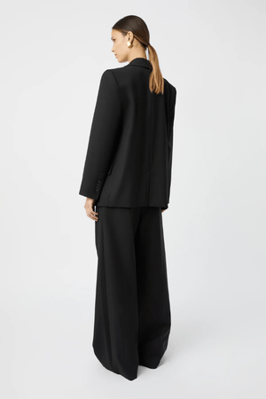 Natalini Blazer Black by Camilla and Marc – Elegant blazer crafted from luxurious Australian wool with sleek satin lapels, forward-rolling shoulders, and a raised swinging back hem.