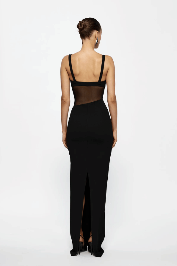 Cyia Gown Black by Effie Kats – Sleek stretch crepe gown with delicate straps, mesh inserts, and low back, featuring a back split for graceful movement and timeless elegance.