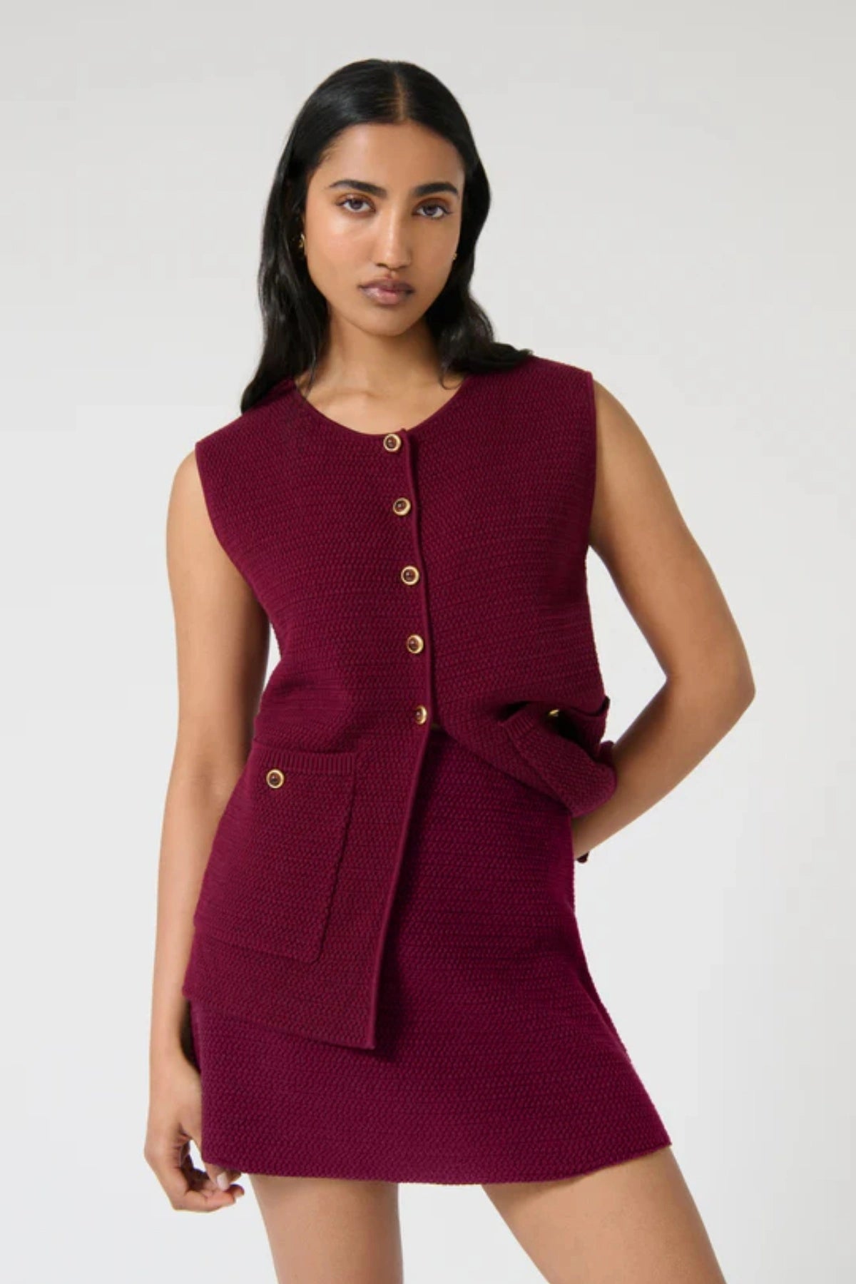 Helena Skirt – Plum by Onte, a cotton crochet mini with elastic waist. Perfect for pairing with the matching gilet or worn on its own.