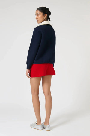 Onte Nerea Sweater in navy and ivory with half zip, two-tone collar, drawstring waist, and relaxed oversized fit.
