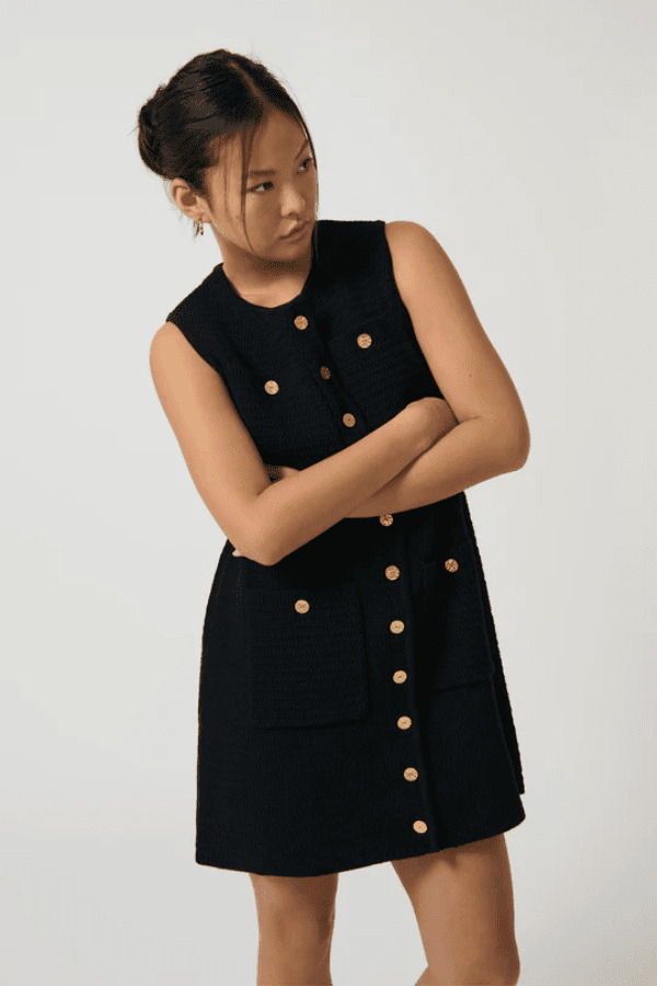 Helena Dress Black by Onte – A trendy, breathable 100% cotton crochet-style gilet with gold buttons and patch pockets, perfect for chic layering and casual elegance.