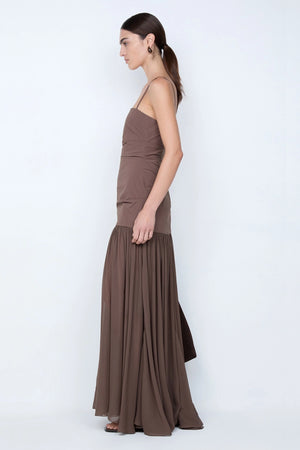 Reid Drop Waist Maxi Dress by Bec and Bridge — a milk chocolate stretch dress with a fitted bodice and sheer godet skirt, perfect for elegant evenings.