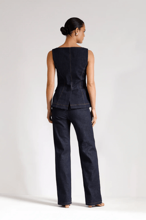 Good Vibes Top Indigo by Pasduchas – Trendy stretch denim with structured fit, gold snap studs, and mock pockets; perfect for chic, coordinated looks.