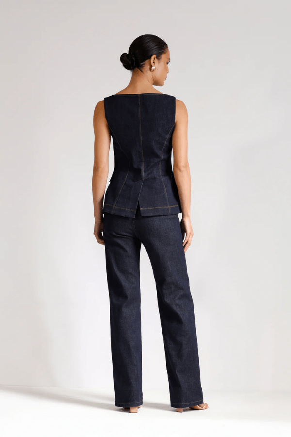 Good Vibes Top Indigo by Pasduchas – Trendy stretch denim with structured fit, gold snap studs, and mock pockets; perfect for chic, coordinated looks.