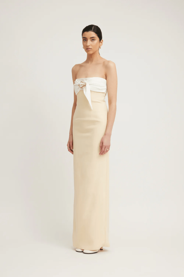 Kasai Dress Lemon/Ivory by Tojhà – A chic strapless maxi with structured bonded fabric, signature buckle detail, and princess seams, perfect for sophisticated events.