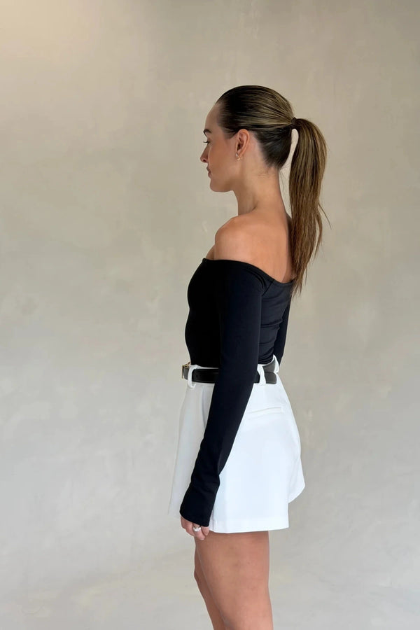 Black Henley long sleeve bodysuit with an off-shoulder neckline and fitted silhouette.