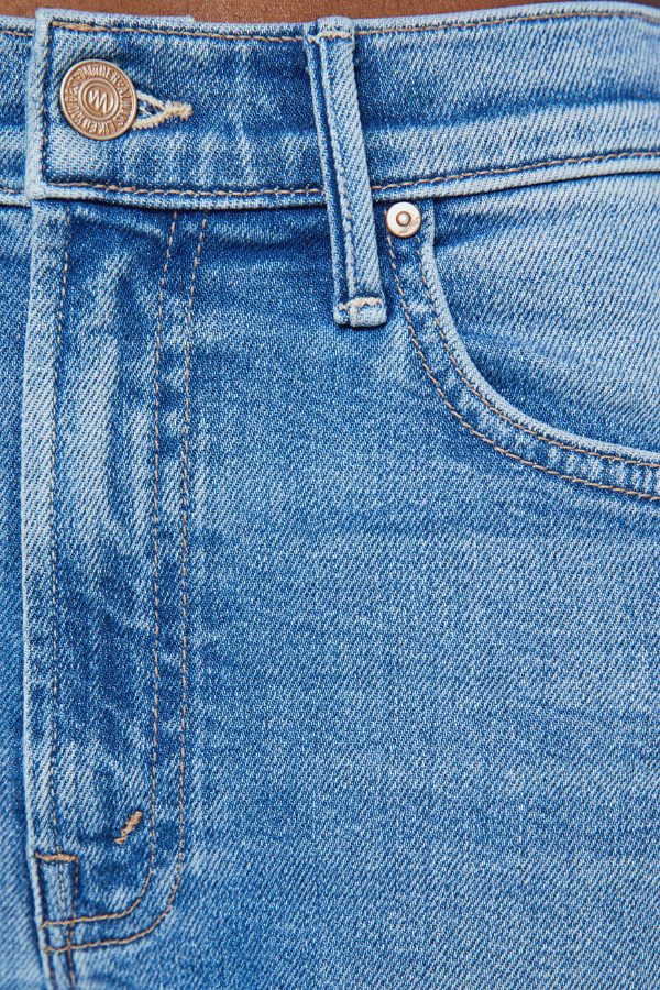 The Kick It Fan Favorite by MOTHER, trendy high-rise straight-leg jeans with a clean hem. Perfect for everyday wear with a mid-blue wash, subtle whiskering, and soft stretch denim for all-day comfort.