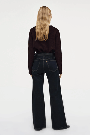 Eva Wide Cannes Dark Indigo by Neuw Denim, trendy tailored wide-leg jeans with a fitted mid-rise waist and A-line cut. Perfect for a feminine, laid-back look in dark indigo denim with subtle fading and contrast tobacco stitching.