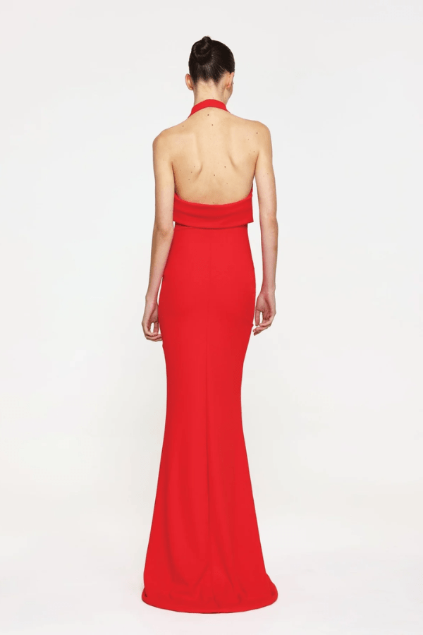Sydney Gown Red by Effie Kats – A bold and trendy stretch-jersey gown with elegant ruching and a daring thigh-high split, perfect for special evening occasions.