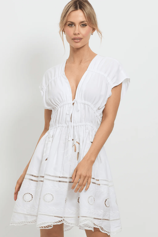Sunrise Spirit Dress White by Pasduchas – A trendy, embroidered Tencel-linen blend dress with adjustable ties and scalloped hem, perfect for chic day-to-night occasions.