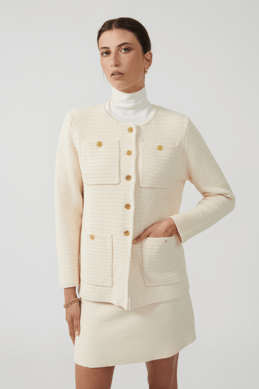 Helena Jacket Ivory by Onte – Breathable 100% cotton crochet-knit jacket with loose fit, gold buttons, crew neck, long sleeves, and patch pockets. Hand wash cold, dry flat.