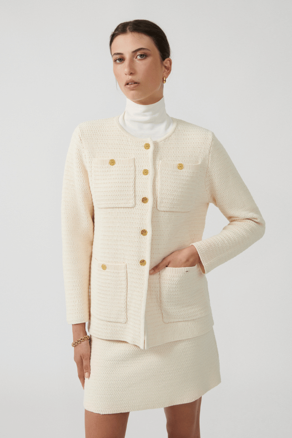 Helena Jacket Ivory by Onte – Breathable 100% cotton crochet-knit jacket with loose fit, gold buttons, crew neck, long sleeves, and patch pockets. Hand wash cold, dry flat.