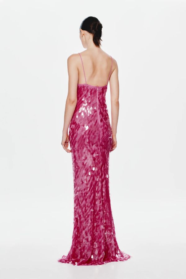 Sapphire Sequin Maxi Dress by Misha, a fuchsia pink gown with plunging cut-out neckline, low back, and voluminous hem. Perfect for events.
