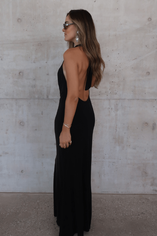 Saint Plunge Maxi Dress Black by Sneaky Link – A trendy halter neck maxi with a bold plunging neckline, silky cupro fabric, perfect for elegant nights and viral occasions.