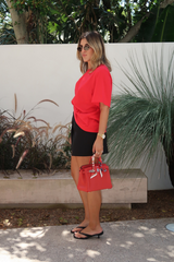 Sneaky Mini Skirt Black by Sneaky Link – A-line high-waisted mini with boned waist and flap pockets, perfect for day-to-night styling.
