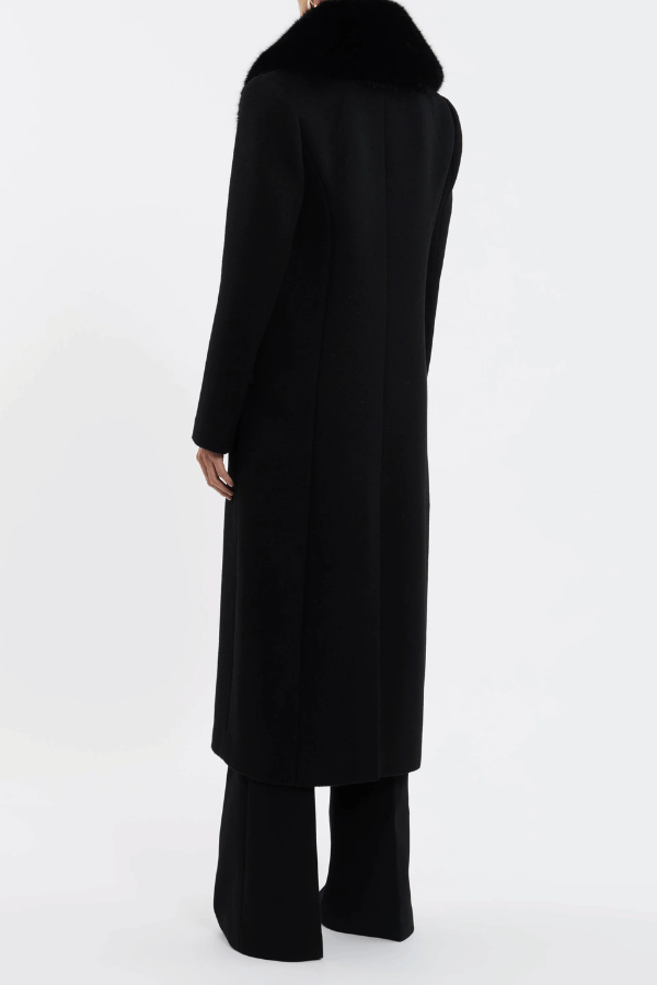 Biera Coat Black by Rebecca Vallance – A boxy, double-breasted wool coat with flap pockets, embossed dome buttons, and removable faux fur trim. Fully lined for comfort.