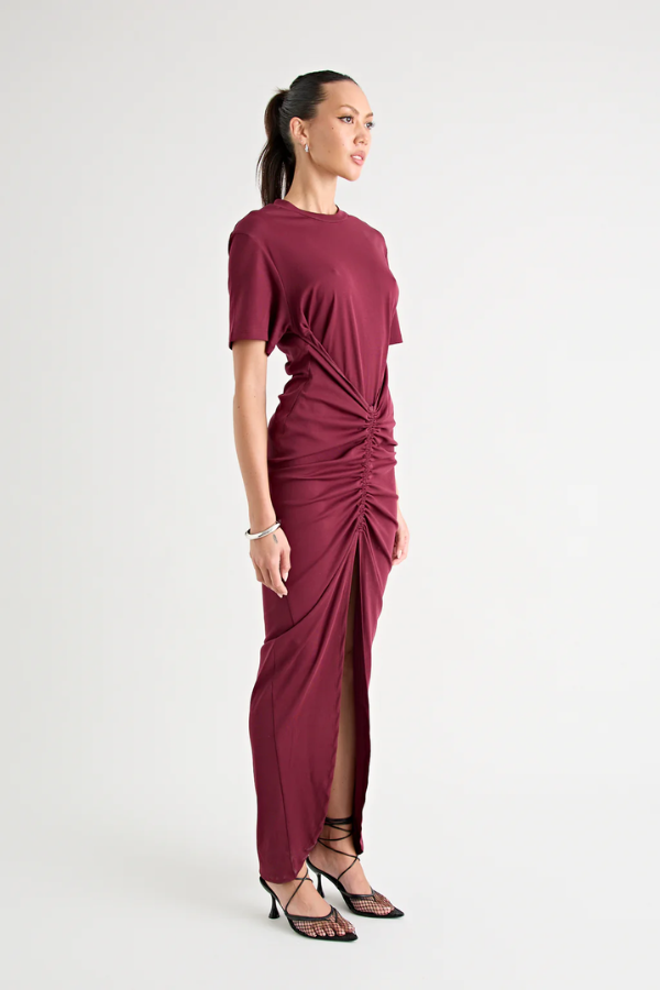 Niko Maxi Dress Burgundy by Pfeiffer – Trendy relaxed T-shirt maxi with adjustable side ruching, crew neck, and breathable cotton blend, perfect for elevated off-duty style and everyday comfort.