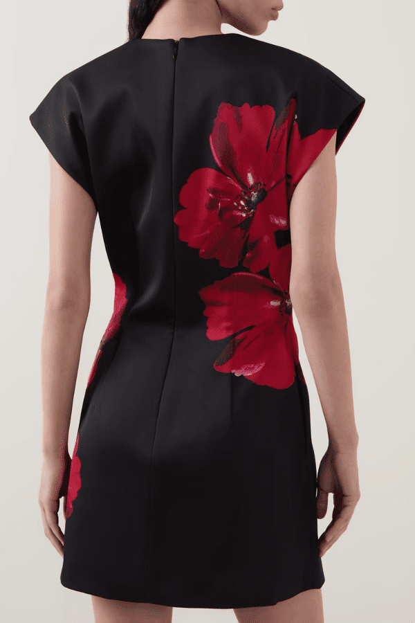 Chaya Mini Poppy Print Black Base by Rebecca Vallance – A trendy structured A-line mini with floral poppy print, round neckline, and dropped shoulders, perfect for special occasions or elevating everyday style with a polished, feminine touch.