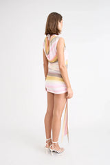 Elara Reversible Dress by Pfeiffer — peach printed mini dress with three-way reversible design and dramatic hem tie detail.