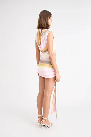 Elara Reversible Dress by Pfeiffer — peach printed mini dress with three-way reversible design and dramatic hem tie detail.