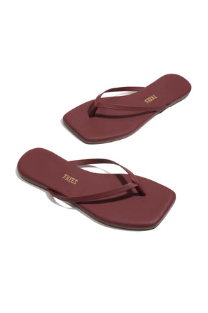 Tkees red suede sandal with clean modern lines, leather insole, and square-toe silhouette, handcrafted in Brazil.
