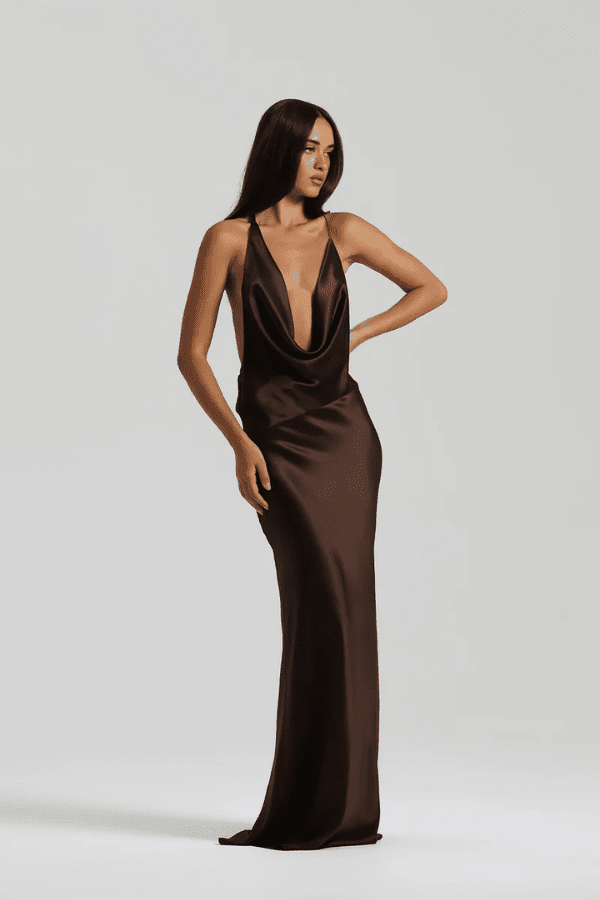 Gabi Gown Espresso by Natalie Rolt – A sleek, asymmetrical silk gown with dramatic open back and adjustable ties, perfect for elegant evening occasions.