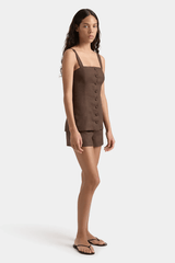Corbiere Vest Bistre by Faithfull the Brand, sophisticated 100% European Flax® linen vest with wide straps, straight neckline, and mock buttons, perfect for trendy viral layering and elegant summer looks.