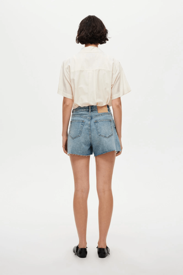 Ryder Short Cosmic by Neuw Denim, a trendy high-rise short with a flattering silhouette, contrast stitching, and signature repair stitch. Perfect for all-season, sustainable style.