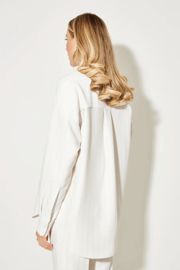 Ultimate Muse Pin Stripe Shirt Oat by Odd Muse — Classic pinstripe button-down with relaxed fit, breathable fabric, and OM embroidery for versatile, polished style.