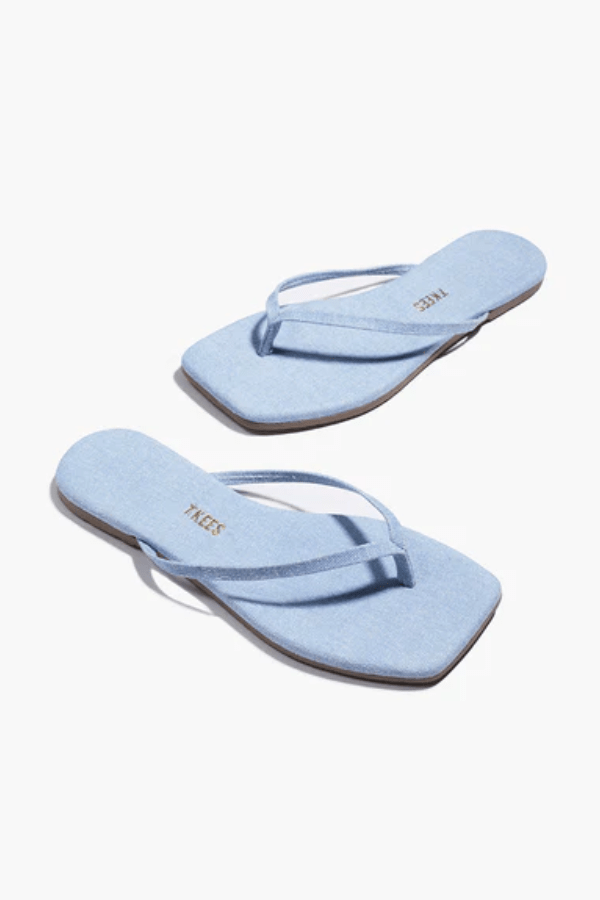 Square Toe Lily Washed Denim by Tkees, a square-toe slide sandal in soft washed denim with a cushioned denim insole and rubber outsole. Handcrafted in Brazil for comfort and style.