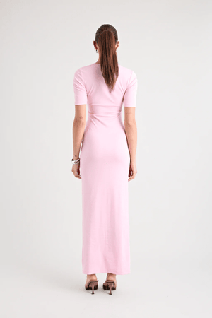 Florence Dress Pink by Pfeiffer – A trendy fitted maxi with cut-out hardware accents, crafted from soft cotton-spandex. Perfect for chic, ethical day-to-night wear. Made in Australia with care.
