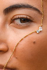 Twin Flame Necklace by Avant Studio in 18k gold plated sterling silver with cubic zirconia and adjustable chain.