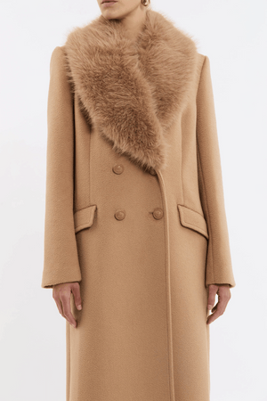 Biera Coat Camel by Rebecca Vallance – Timeless boxy double-breasted wool coat with embossed dome buttons and removable faux fur trim. Features flap pockets, back vent, and full lining.